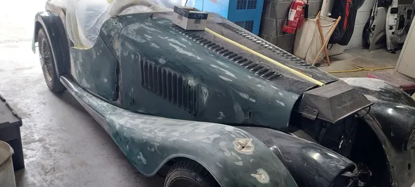 Morgan classic car bodywork with filler and primer during surface preparation