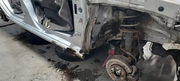 VW Polo corrosion damage - inner arch decay and sill perforation