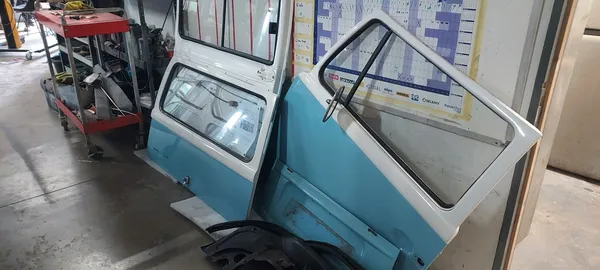 Classic VW Type 2 Bay Window camper with doors removed during strip-down at CPRS Grimsby