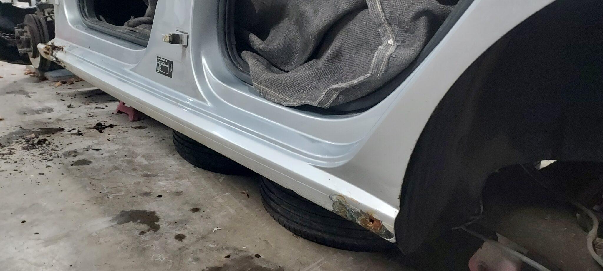 VW Polo structural corrosion close-up showing compromised jacking points